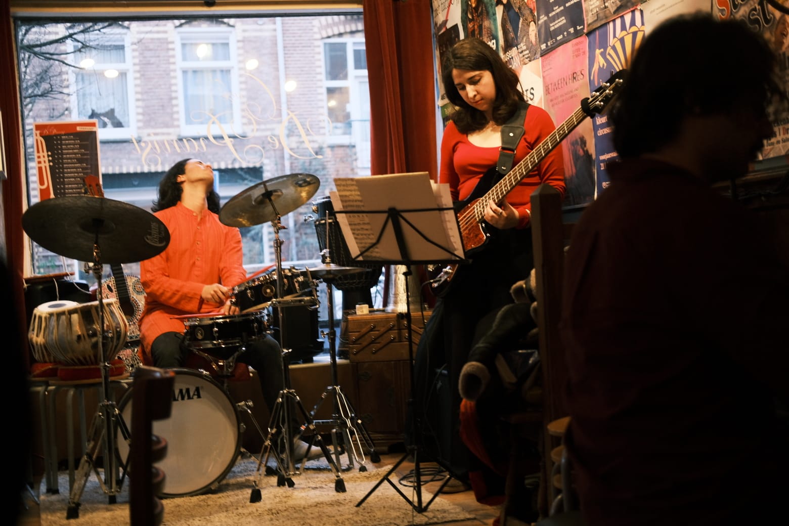 Eastern Periphery performing live at a venue window