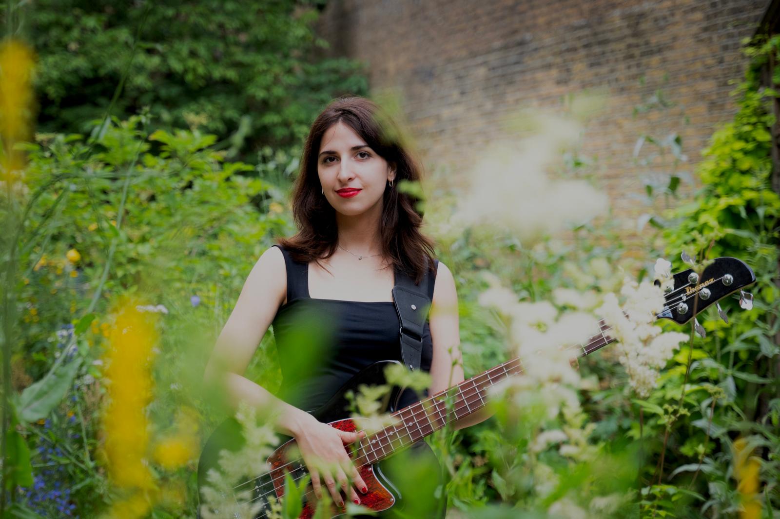 Nina Cekov with her bass guitar